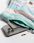 Designer Men’s Resort Wear, Swim Shorts & Luxury Swimwear Accessories | Riviera Bathers | Swim Trunks | Rancho Mirage | Pink, Green, Peach, and White Stripes | Hidden Zipper Pocket