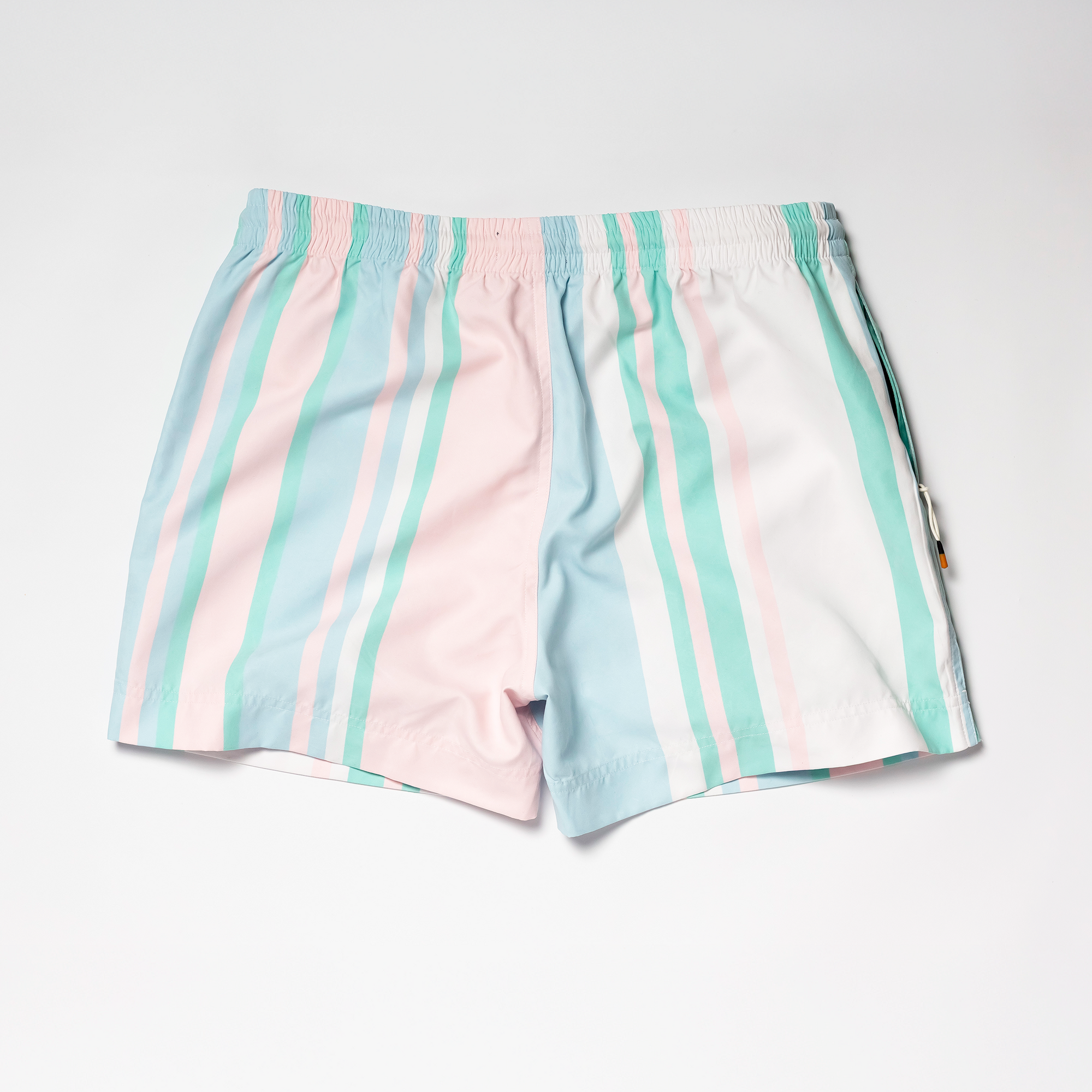 Designer Men’s Resort Wear, Swim Shorts & Luxury Swimwear Accessories | Riviera Bathers | Swim Trunks | Rancho Mirage | Pink, Green, Peach, and White Stripes