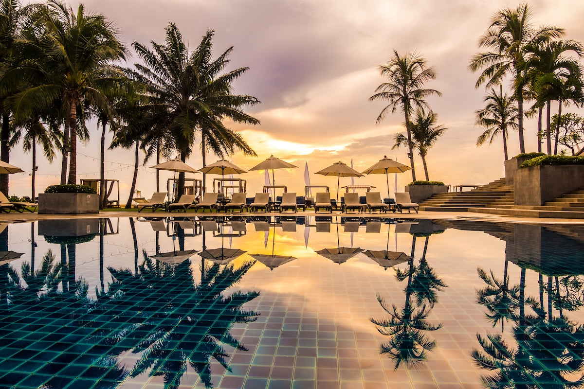 Luxury resort pool at sunset